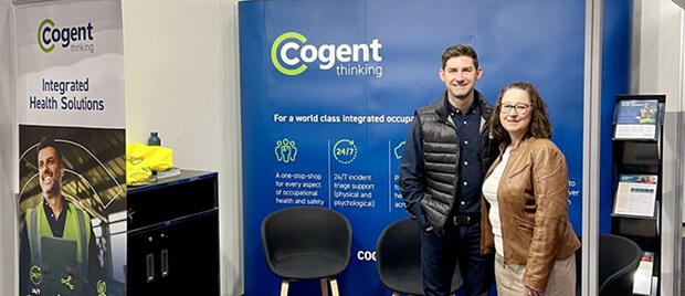 A man and woman posing for a photo at AFAC 2025.