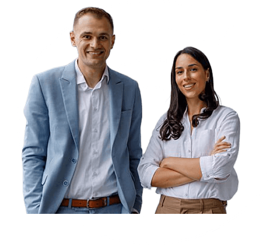 A man and woman smile to camera