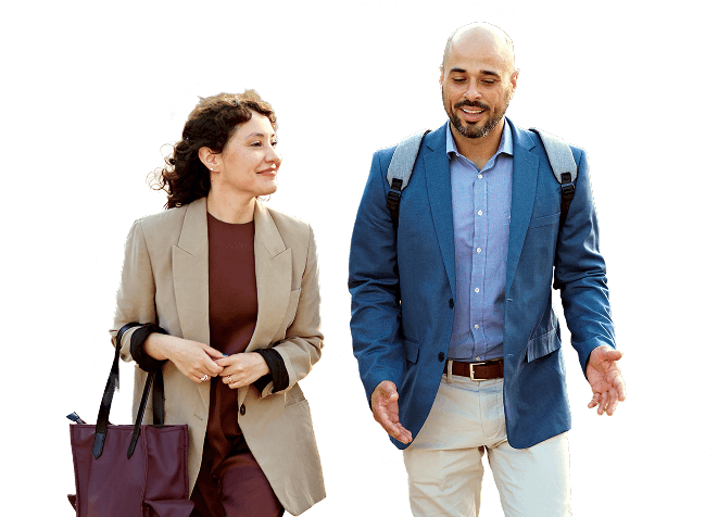 Male and female coworkers walking and talking