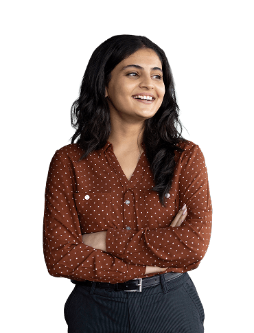 A woman in corporate attire smiling away from camera