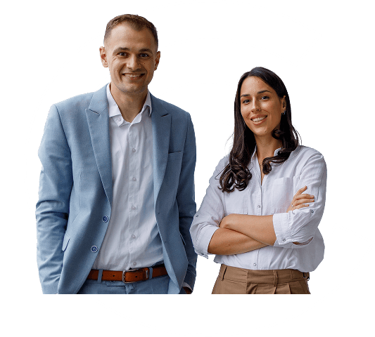 A man and woman smile to camera