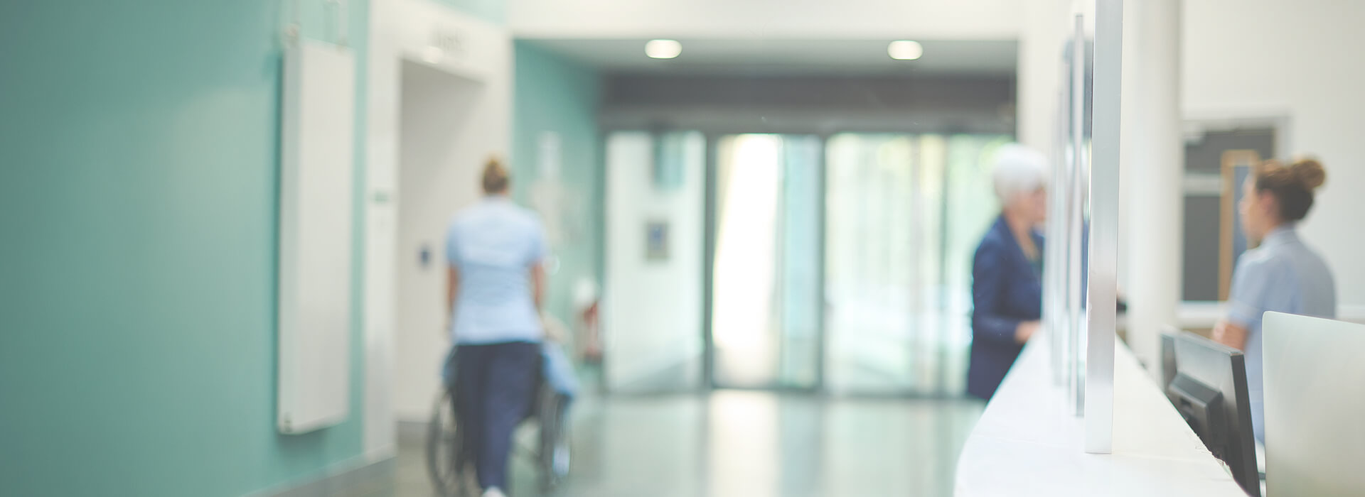 An out-of-focus photo of a hospital corridor