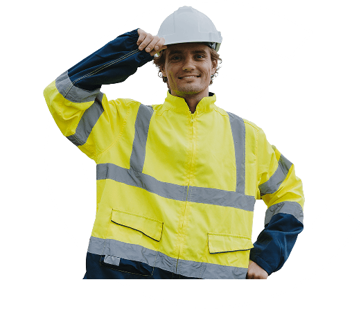 A man in hi-vis and a hard hat smiling to camera